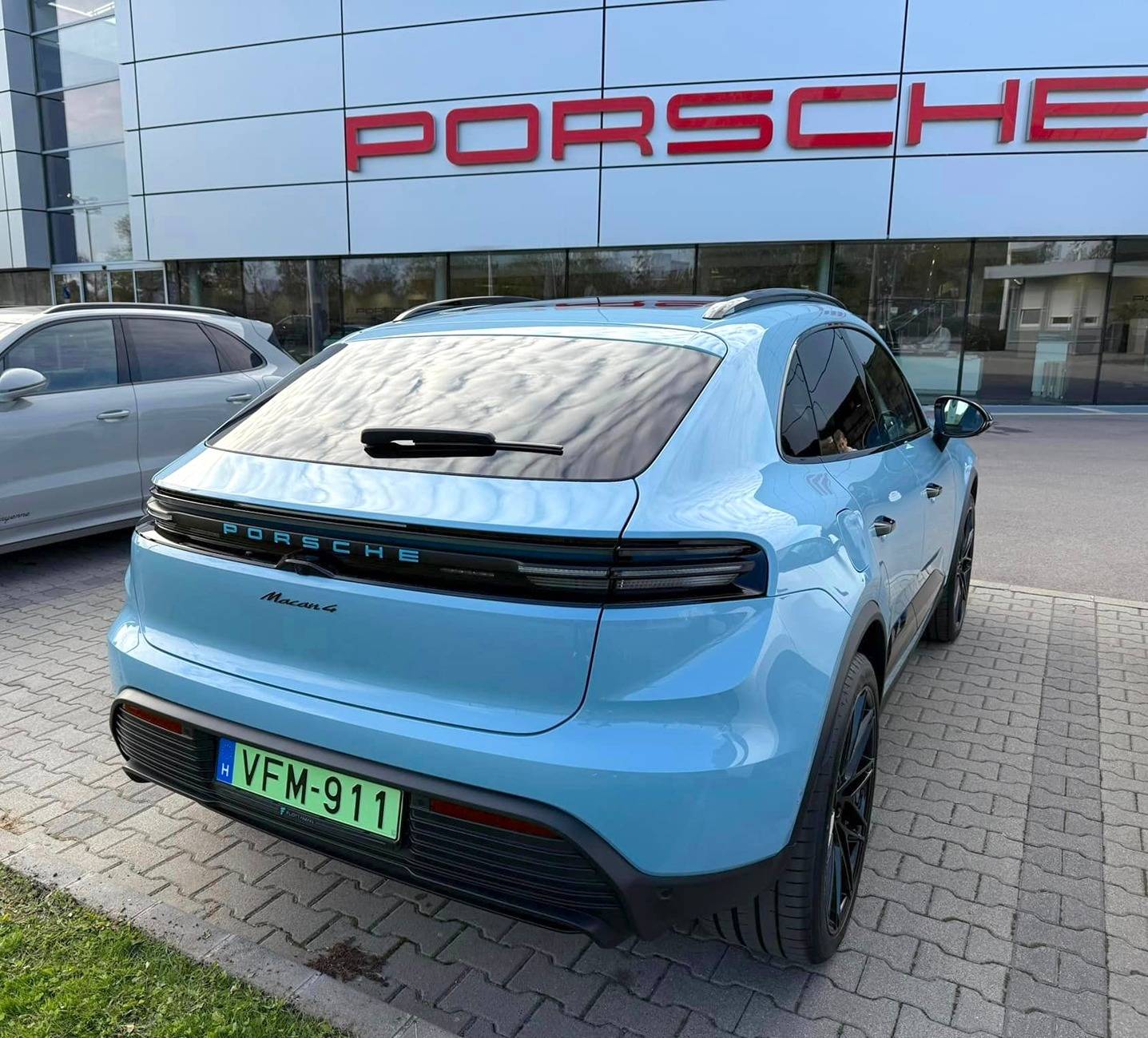 Electric Macan EV FROZEN BLUE Macan EV Photos Thread frozen blue macan ev glacier ice blue tail light logo