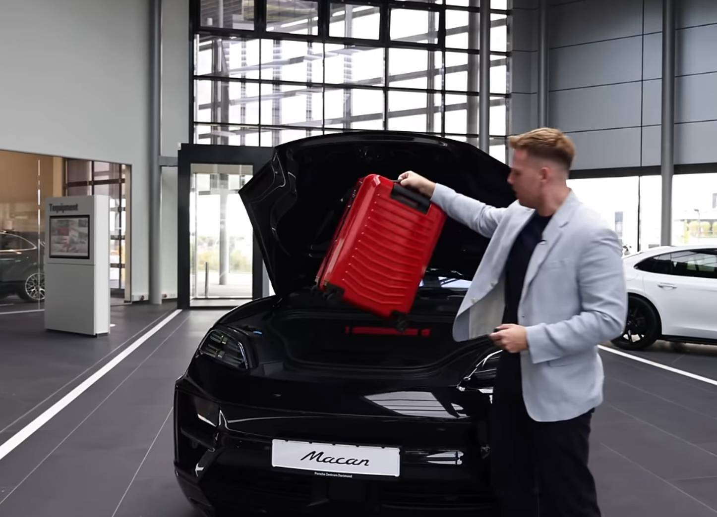 Electric Macan EV Video showing Macan frunk fitting plane carry-on suitcase / luggage IMG_1766