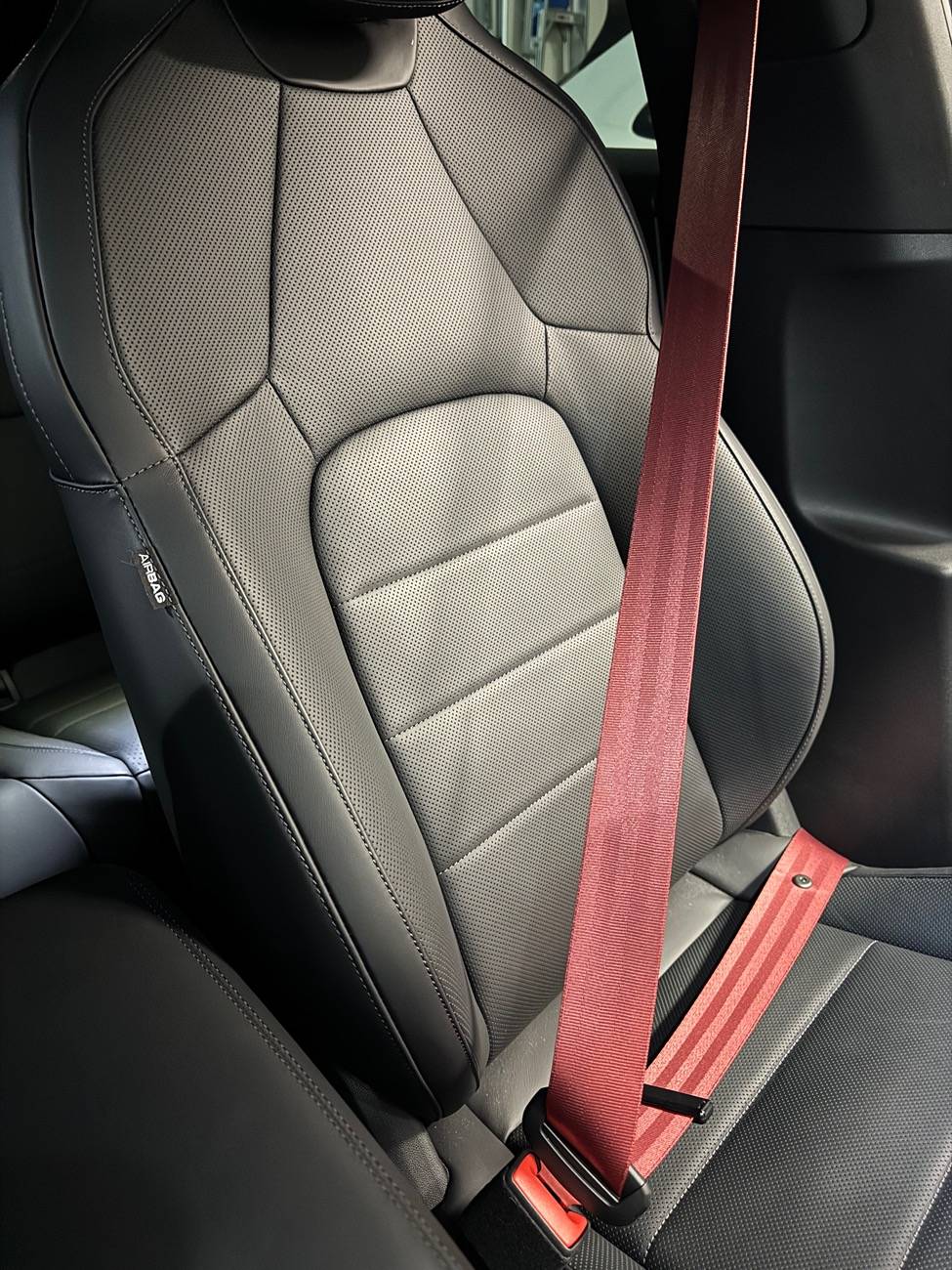 Electric Macan EV Coloured seat belt on black interior IMG_6271