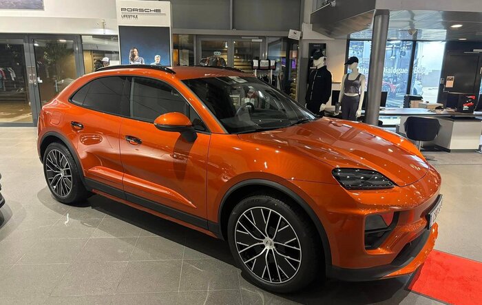 Papaya Macan EV w/ Offroad Package, No Side Blades, Partial Debadged (Macan & Electric Letters)