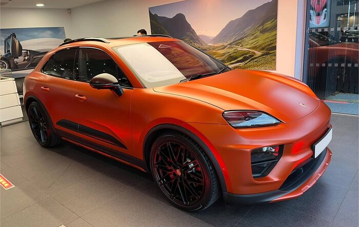 Stealth satin PPF film wrap on Papaya Orange Macan EV